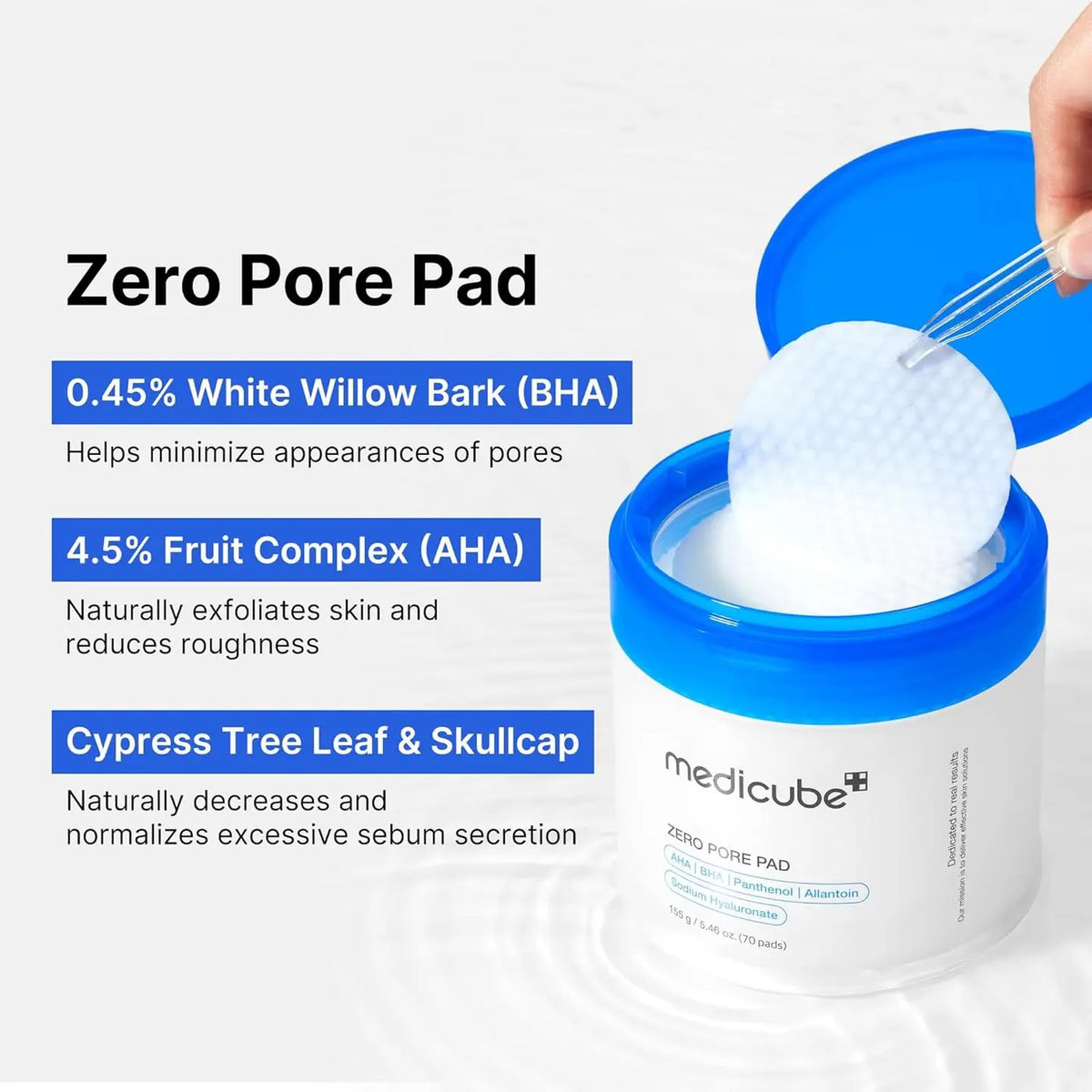 The image depicts two containers of MEDICUBE - ZERO PORE PAD by ASIAN BEAUTY WHOLESALE. One container is closed showing the label, while the other is open, displaying white textured pads designed to minimize pores, exfoliate skin, and control sebum production effectively.