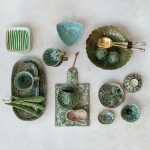 The GREEN STONEWARE PLATTER WITH REACTIVE CRACKLE GLAZE by CREATIVE COOP features a handcrafted, rustic finish and textured green glaze—perfect as a unique serving dish for any occasion.
