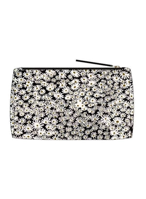 The INOUI EDITIONS - PAMPAS COSMETIC POUCH by INOUI is a rectangular zipper pouch expertly crafted from durable nylon cosmetic pouch material. It showcases a bold pattern of two cheetahs surrounded by dense white daisy-like flowers set against a black background. Made in India, this stylish pouch blends practicality with distinctive design.