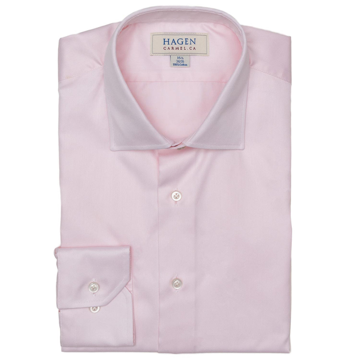 The HAGEN - COTTON DRESS SHIRT IN LIGHT PINK features premium cotton, a modern spread collar with a "Hagen" label, white buttons, and a classic single cuff.