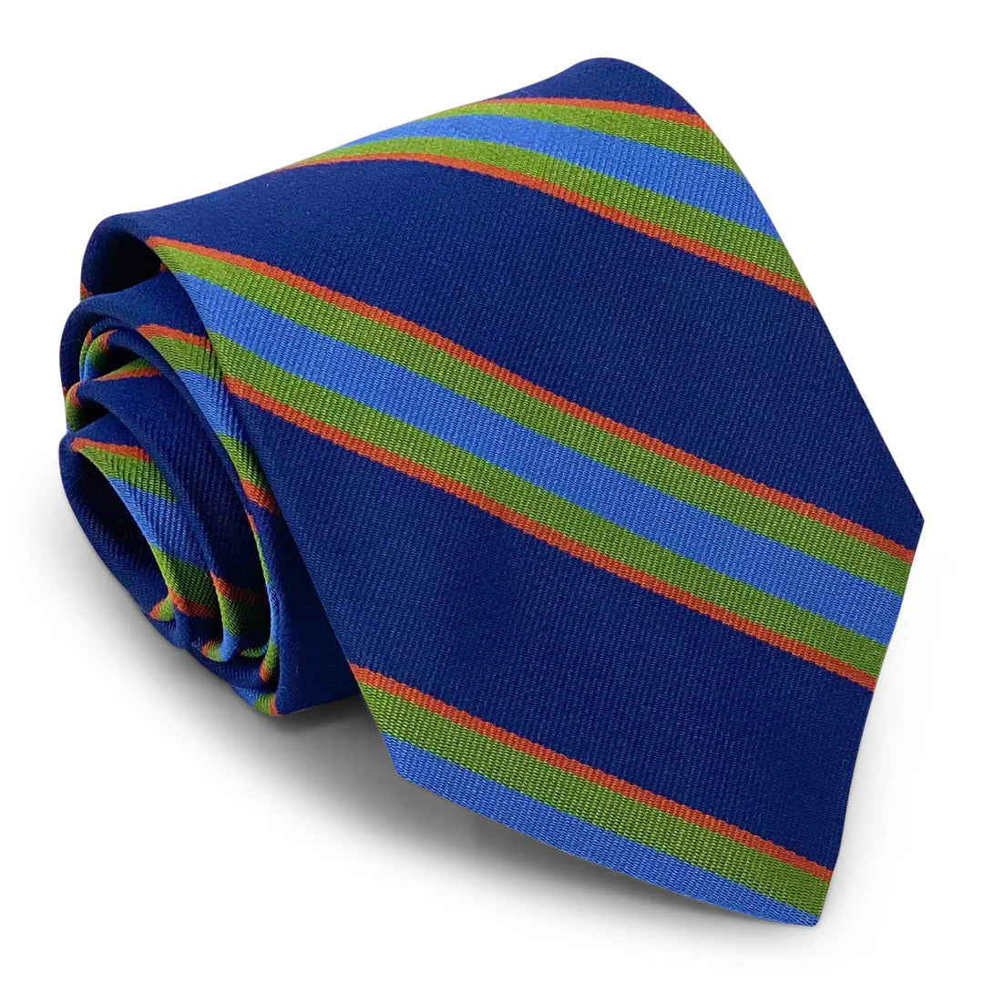 The Bird Dog Bay Peter Blair - Marshtown Tie in Navy/Blue is a rolled-up silk necktie with green, light blue, and thin red diagonal stripes. Handmade in New York, it’s shown on a white background.