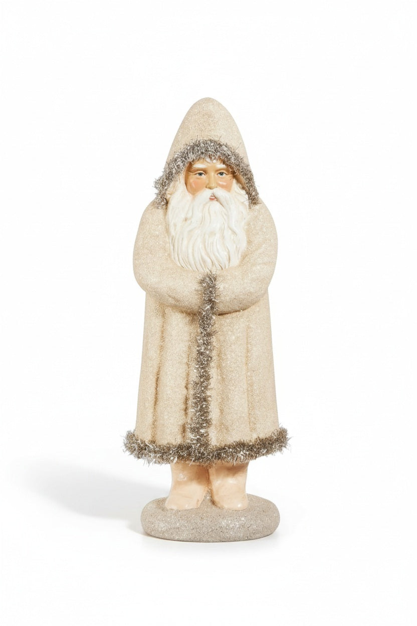 15″ GLITTERED BELLSNICKEL SANTA figurine wearing a hooded, glittery cream-colored coat with tinsel trim, displayed next to a 5 inch tall decorative vase.