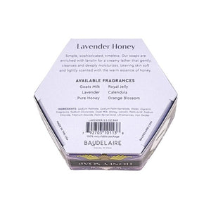Experience the luxurious BAUDELAIRE - LAVENDER HONEY SOAP 3.5 OZ, HEX BOX—a triple-milled bar delicately scented with lavender. Presented in a hexagonal purple box adorned with elegant floral designs and a central lavender flower illustration, this nourishing soap from BAUDELAIRE offers a gentle and soothing cleanse.