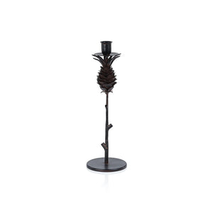 The ZODAX PINECONE WROUGHT IRON CANDLEHOLDER - MEDIUM features a black iron pine cone design atop a slender branch on a round base, measuring 4.5" x 13". Shown against a white background.