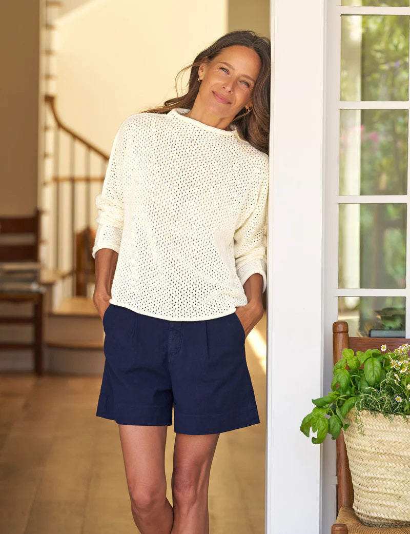 The FRANK &amp; EILEEN Monterey Pointelle Rolled Funnel Neck Sweater in ivory features a cream hue, long sleeves, waffle-knit texture, and luxurious Italian cotton, showcased flat on a white background.