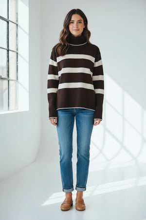 The SEVENTY VENEZIA - BOLD STRIPE TURTLENECK by SEVENTY features wide white stripes on black, long sleeves, and a relaxed fit. This stylish Italian-made sweater is shown on a plain light background.