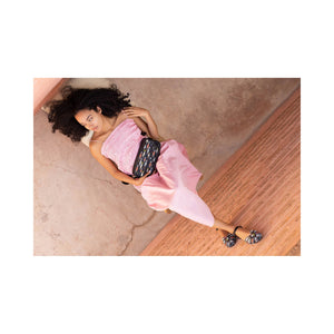 Introducing the MEHER KAKALIA TAVIRA CLUTCH MAGMA BLACK WITH FISHES: an eco-friendly goat leather handbag with vibrant fish motifs and a daisy design. It includes a detachable strap for versatile, stylish, and sustainable wear.