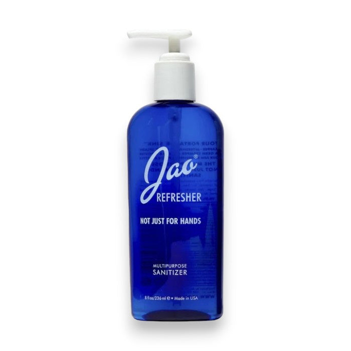 A blue pump bottle labeled "JAO BRAND - HAND REFRESHER 8 OZ" from JAO LIMITED, containing 8 fluid ounces (236 ml) of moisturizing disinfectant with antiseptic essential oils, made in the USA.