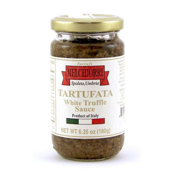 A jar of MELCHIORRI - WHITE TRUFFLE SAUCE from ATALANTA CORPORATION, with a net weight of 6.35 oz (180g). The label indicates it is a product of Spoleto, Umbria, Italy. Made from exquisite White Piedmont Truffles and button mushrooms, the jar features a gold lid and a white label adorned with red and green accents.