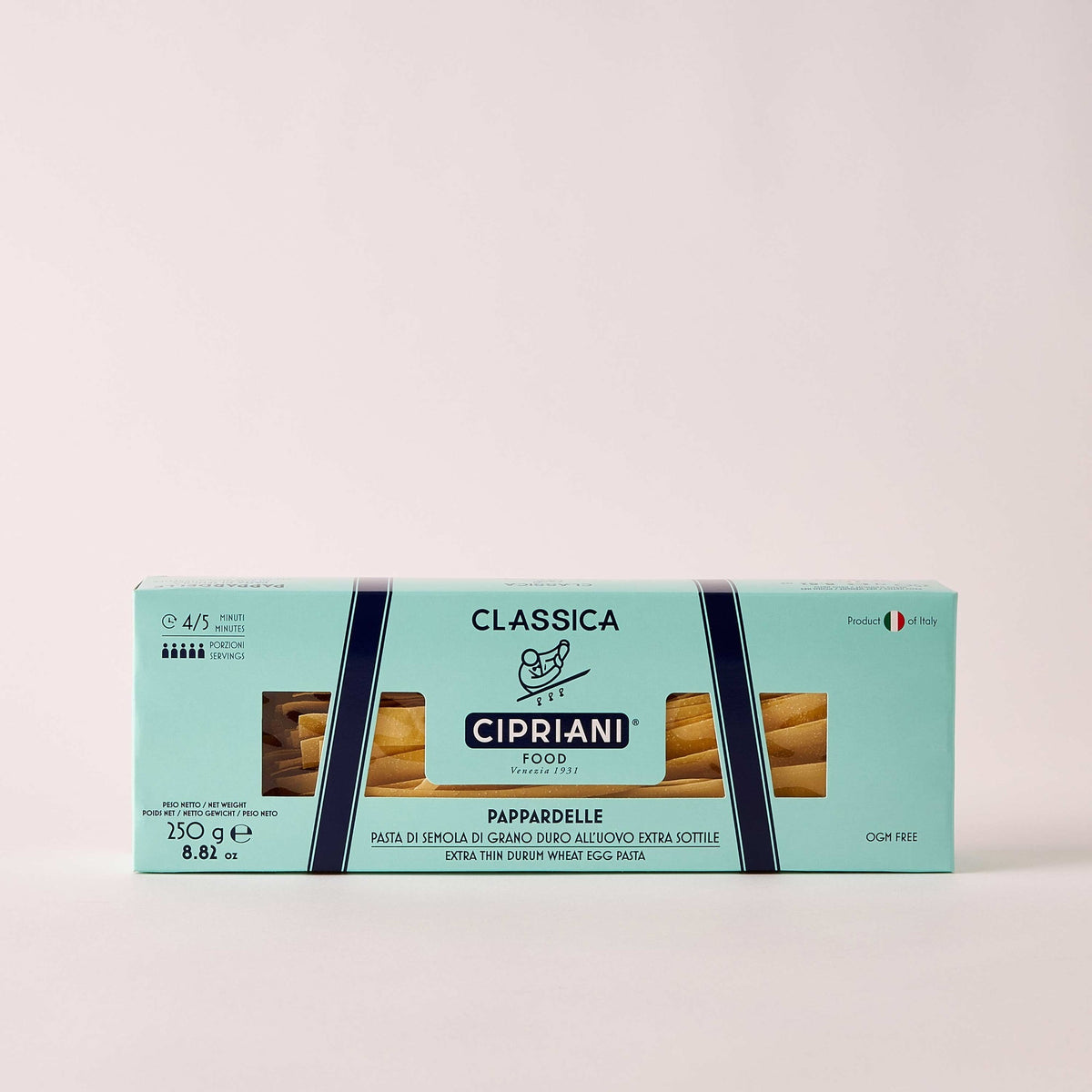 A rectangular box of Cipriani Organic Egg Pappardelle Pasta, produced by Atalanta Corporation and made in Italy, is displayed against a pale background. The light blue packaging with dark blue and white accents features branding details, cooking information, and a small Italian flag denoting its origin.