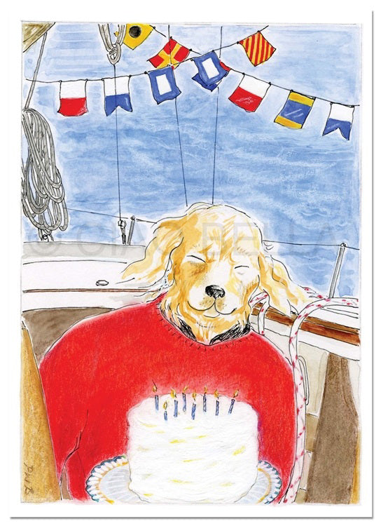 Illustration of a golden retriever wearing a red sweater, sitting on a sailboat. The dog is in front of a white birthday cake with lit candles. Nautical flags are strung above, and the background includes a blue sky and part of the boat's mast and ropes, reminiscent of the charming CIAO BELLA - ALL HANDS ON DECK CARD by CIAO BELLA.