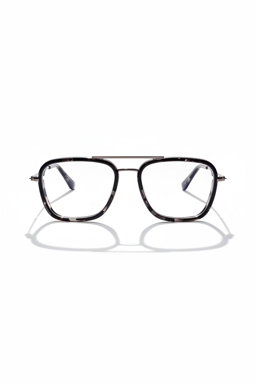 The CADDIS Stanton Progressive Glasses in Black Tortoise feature a minimalist aviator-style metal frame with a sleek metal bridge, displayed on a white background with a subtle shadow beneath the frames.