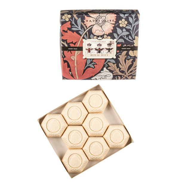 A vintage aesthetic gift box from BAUDELAIRE, named the &quot;ROYAL JELLY HONEY SOAP,&quot; displays a charming floral and bee design. Inside, the opened box reveals eight hexagonal soap bars, each embossed with a bee emblem. This decorative set is reminiscent of royal jelly&#39;s rich texture and hydration properties.