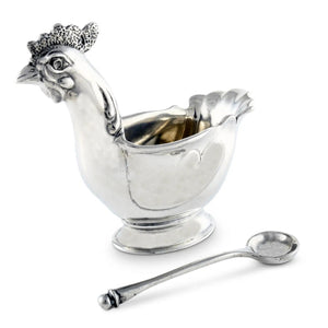 The VAGABOND HOUSE PEWTER HEN SUGAR BOWL WITH SPOON features a luxury-grade pewter chicken-shaped bowl with intricate comb and wattle details, filled with granulated sugar and accompanied by a matching spoon.