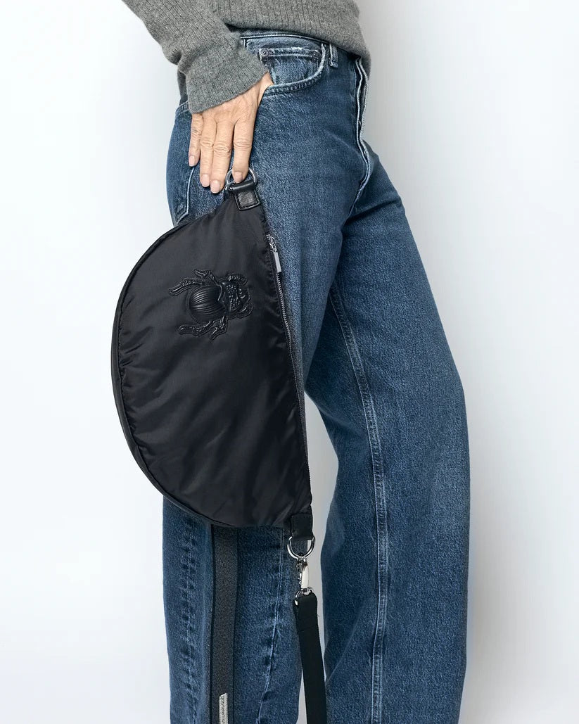 The GABRIELE FRANTZEN - SCARAB NYLON XL BELTBAG IN BLACK is a half-moon crossbody bag crafted from luxurious Italian nylon, featuring a matching black scarab beetle design on the front, silver-tone hardware, and an adjustable strap. This sleek nylon beltbag by GABRIELE FRANTZEN is displayed against a plain white background.