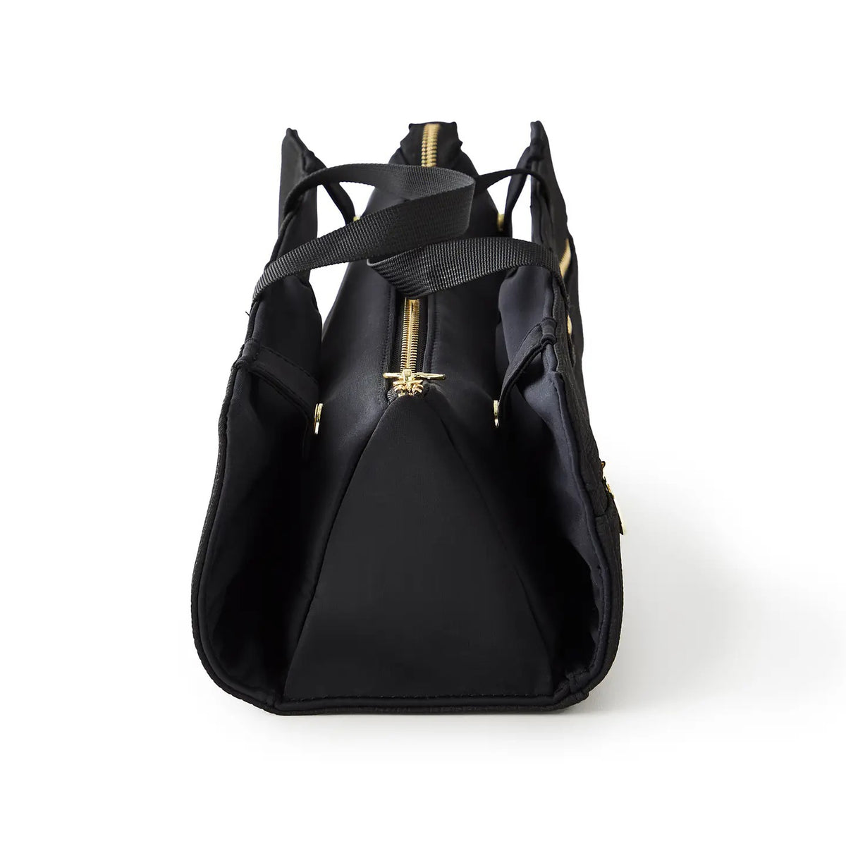 The KUSSHI - HAIR TOOLS TRAVEL BAG IN BLACK by KUSSHI is a rectangular neoprene organizer with two handles, gold zippers, and a white front label, shown against a white background.