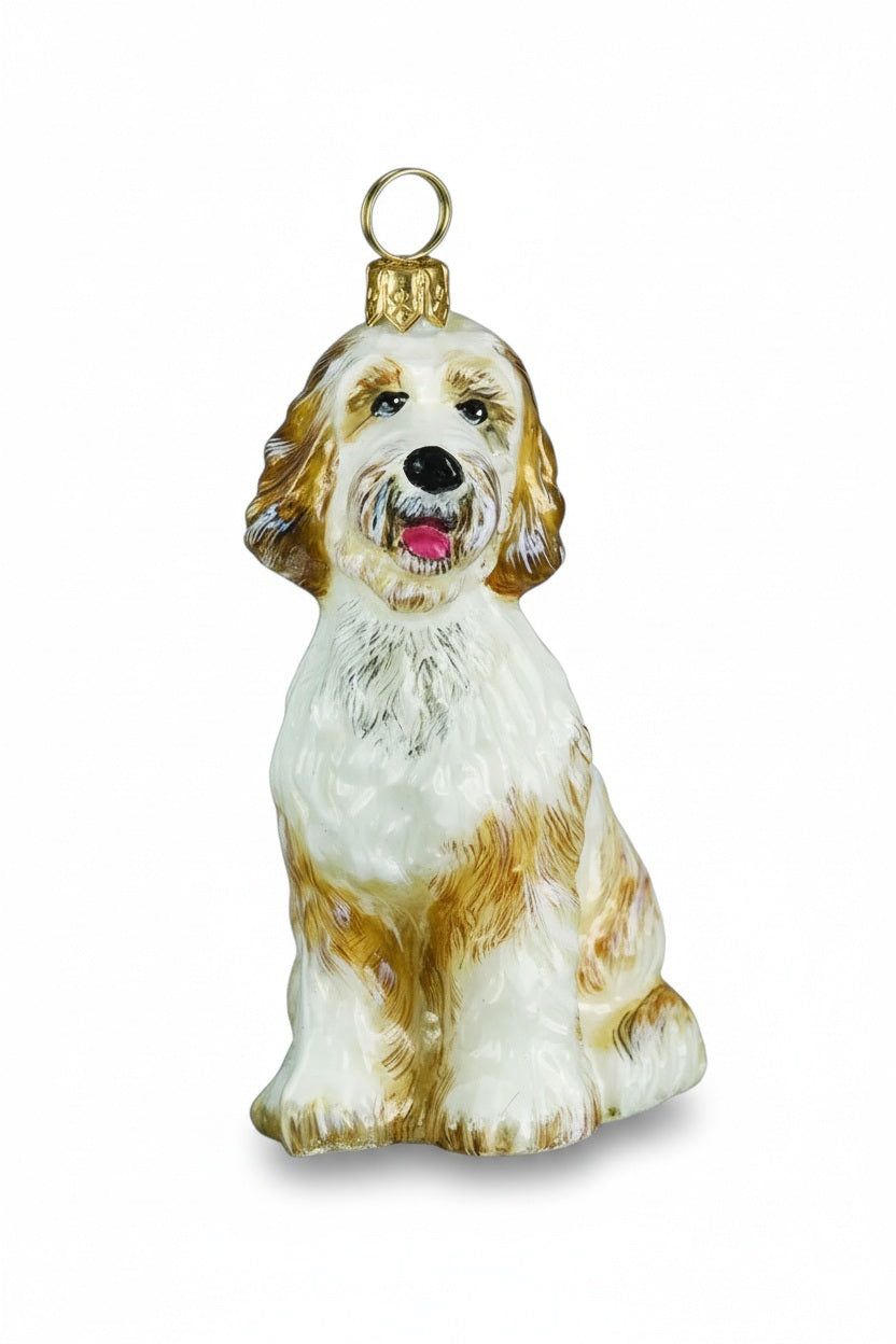 Handmade GOLDENDOODLE ORNAMENT, a sitting cream and brown glass dog with a gold hanging loop.