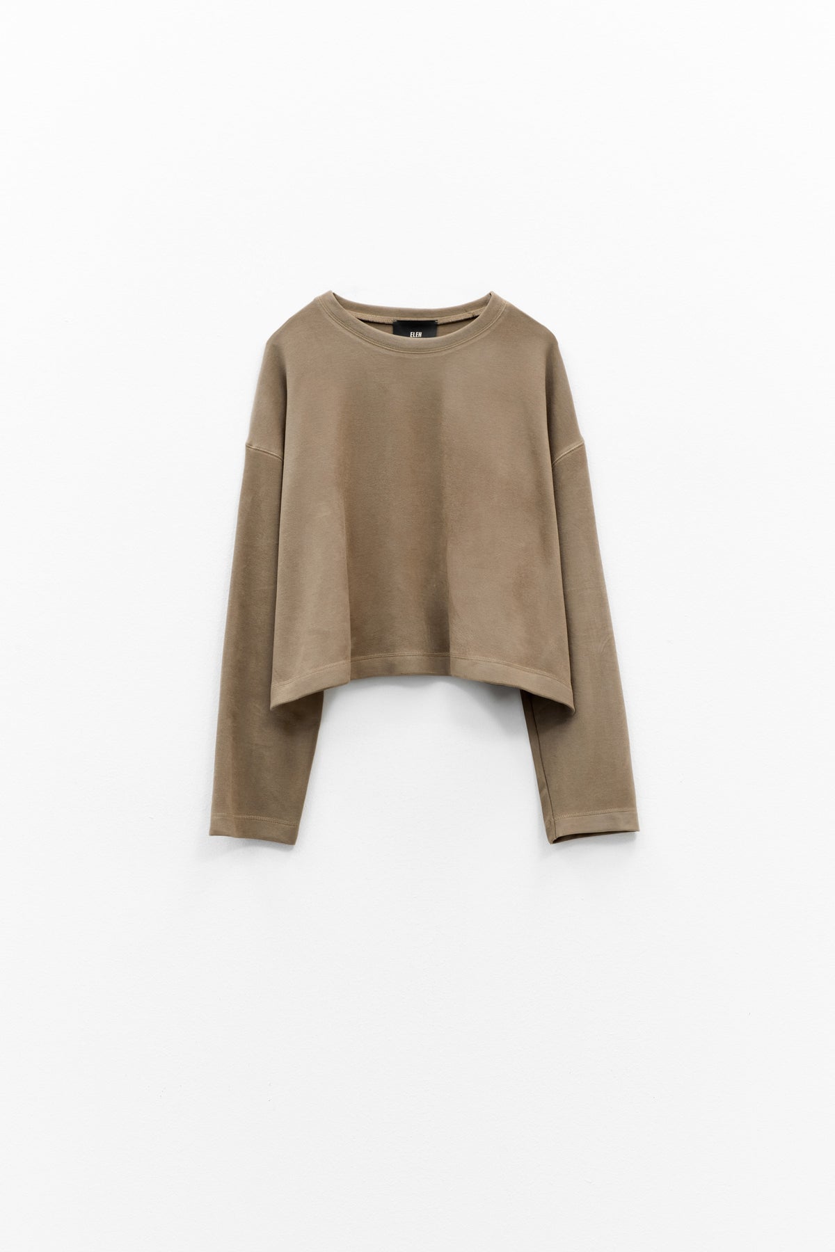 The ELEH - THE SCALA SWEATSHIRT by ELEH is a taupe, long-sleeve cropped sweatshirt featuring dropped shoulders and a relaxed fit, shown against a plain white background.