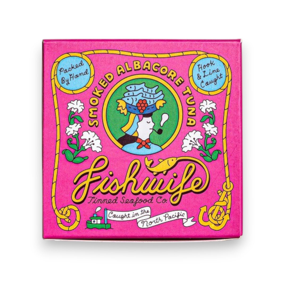 A vibrant square package of FISHWIFE - WILD CAUGHT SMOKED ALBACORE TUNA set against a white backdrop. The packaging showcases an illustrated fish wearing a hat, surrounded by text and decorative accents. Made from MSC-certified albacore tuna sourced from British Columbia and smoked in small batches, the main colors featured are pink, yellow, blue, and green.