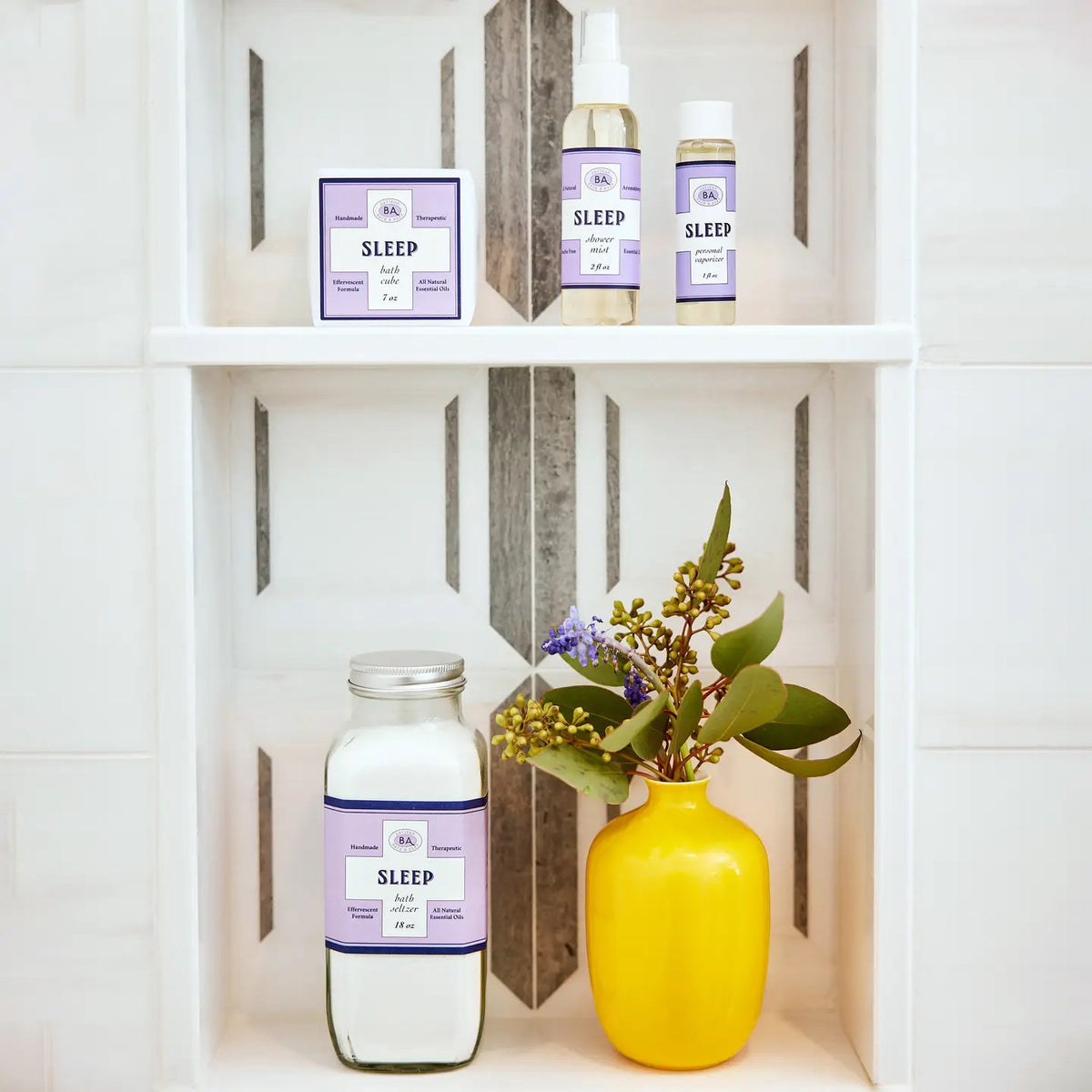 BAUDELAIRE&#39;s Sleep Shower Mist features a calming purple and white design. This natural, phthalate-free aromatherapy spray is infused with lavender essential oils, and its convenient 2 oz size brings tranquility on the go.