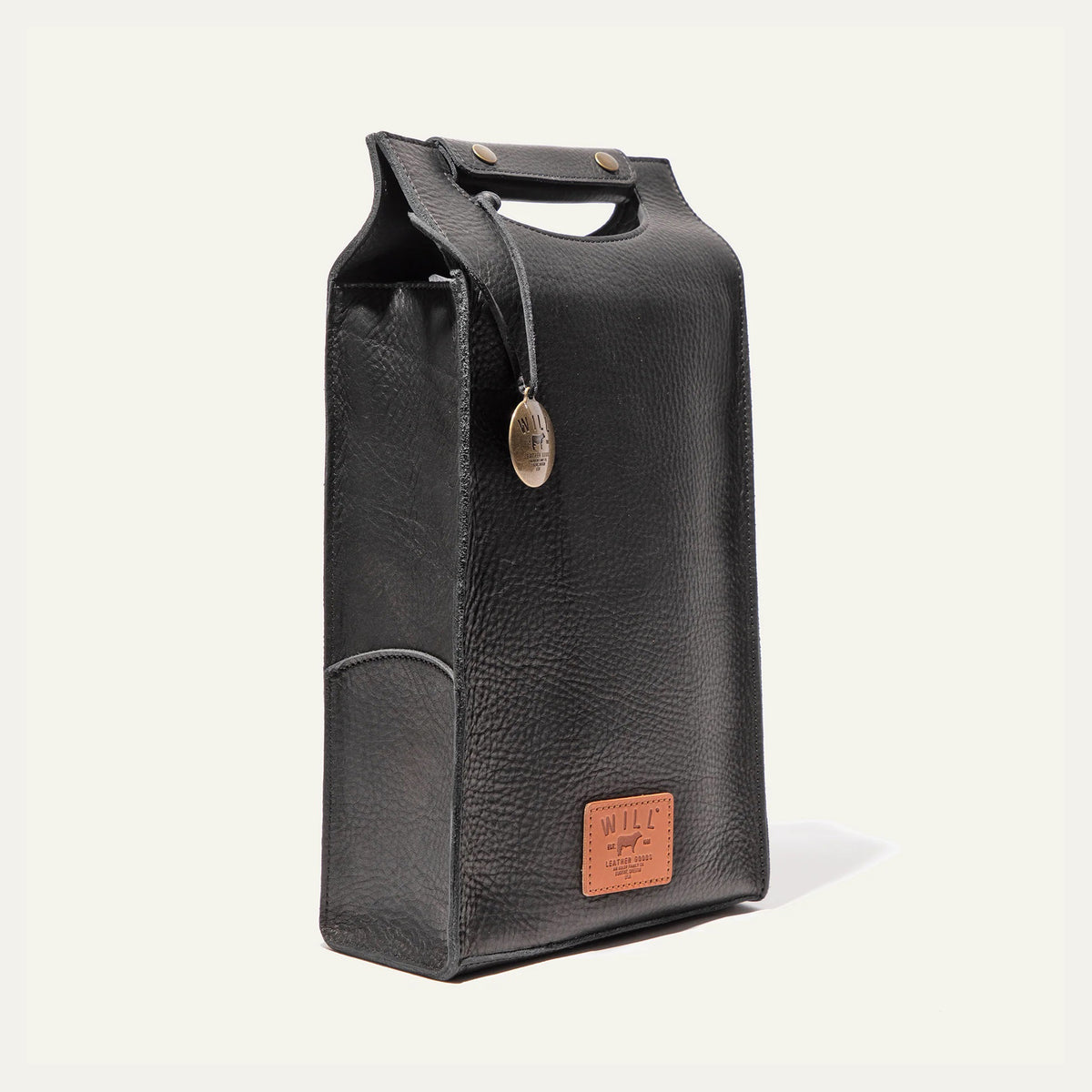 The WILL LEATHER GOODS - DOUBLE LEATHER WINE CASE is a brown full-grain leather tote featuring a top handle cutout, two metal snaps, round metal tag, and stitched "WILL" label—ideal for carrying wine in style.