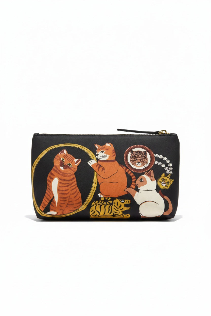 The INOUI EDITIONS - COLLECTIONNEUR CAT COSMETIC BAG by INOUI is a black clutch adorned with illustrations of a maneki-neko cat, a jaguar mask, a small gold animal, and an ancient vase featuring two animal figures. Crafted from stylish polyester with bovin leather accents, this bag features a top zipper closure and a sleek decorative design.