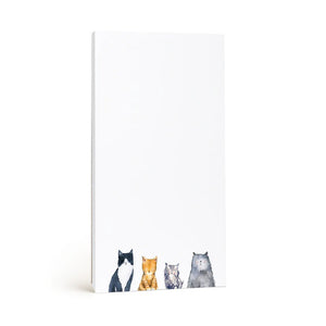 E. FRANCES PAPER's CATS NOTEPAD, made in the USA, features a minimalistic design with recycled paper and charming illustrations of black & white, orange, gray, and brown cats along the bottom edge. The crisp white background offers ample blank space.