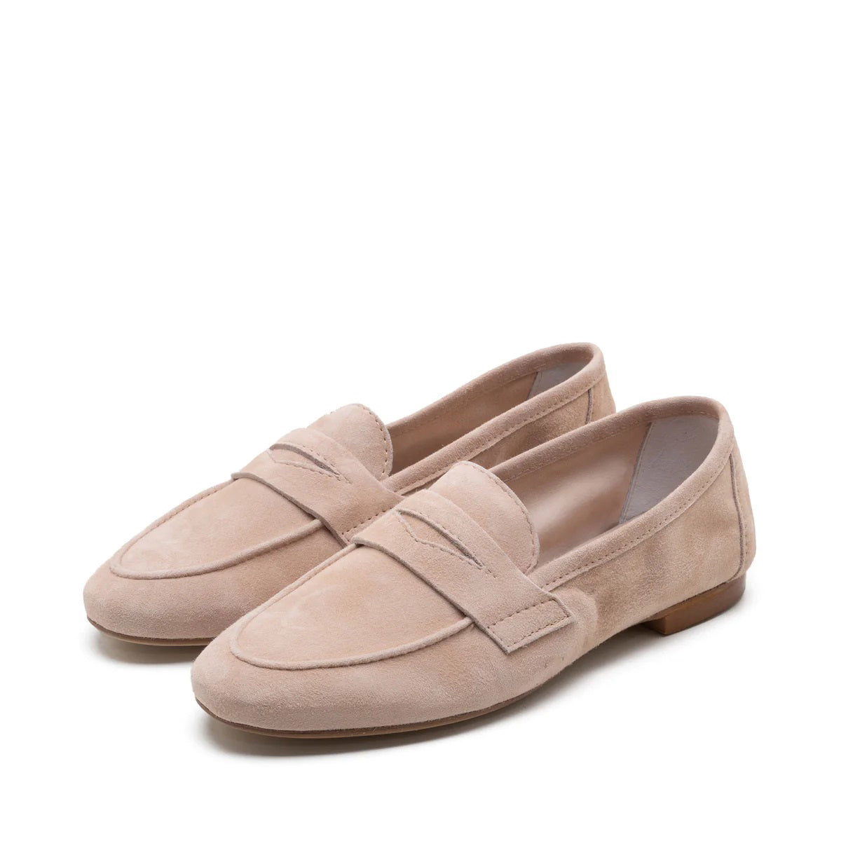 A side view showcases the MICHELE LOPRIORE - PAOLA SUEDE LOAFER in beige against a white background. This mocassin-style loafer, crafted from genuine leather, features a smooth texture with a simple design and low heel.