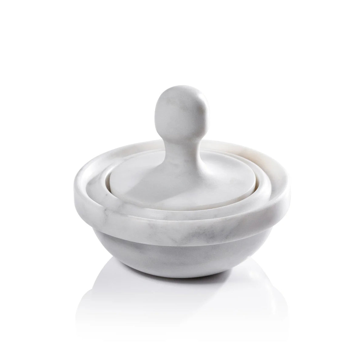 The ZODAX MARBLE SPICE GRINDER features a white marble mortar—a shallow, round bowl—and a dome-shaped pestle with a rounded handle, all set against a white background.