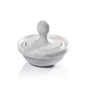 The ZODAX MARBLE SPICE GRINDER features a white marble mortar—a shallow, round bowl—and a dome-shaped pestle with a rounded handle, all set against a white background.