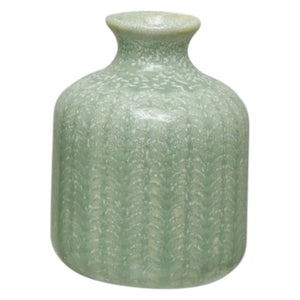 Close-up of the GRAY EMBOSSED STONEWARE VASE, SMALL by CREATIVE COOP reveals a repeating, symmetrical pattern resembling interwoven green and beige threads—much like knitted fabric or stylized leaf motifs.