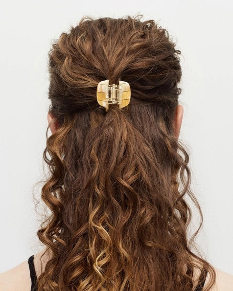 The MACHETE - MINI CLAW by MACHETE is an Italian acetate hair clip in a brown and beige tortoiseshell pattern, featuring a rounded top and multiple curved gripping prongs, shown against a plain white background.