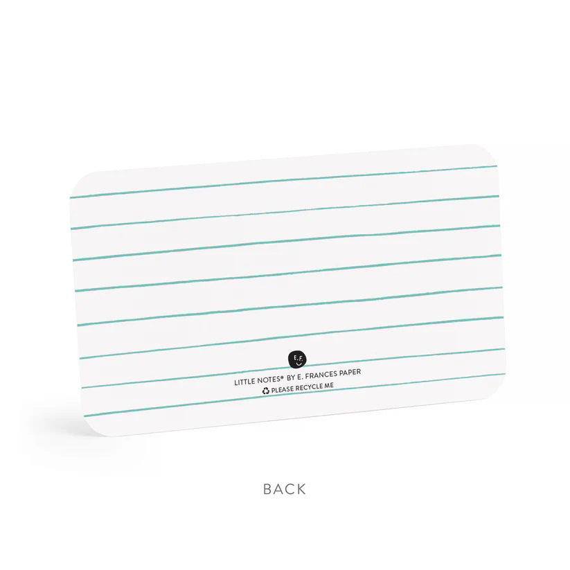 A clear plastic box contains E. Frances Paper - Thanks Little Notes, each decorated with "THANKS!" on the cover. These charming cards showcase a subtle watercolor design, encouraging generous use for any occasion.