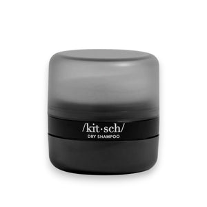 A black and gray cylindrical container of KITSCH Volumizing Rice Water Protein Dry Shampoo is set against a white background, elegantly displaying the KITSCH brand name on the front.