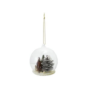 The CREATIVE COOP SNOW GLOBE ORNAMENT WITH WOODLAND SQUIRREL is a clear glass ornament with a gold hanging string, showcasing a pinecone, squirrel, and snowy ground scene inside.