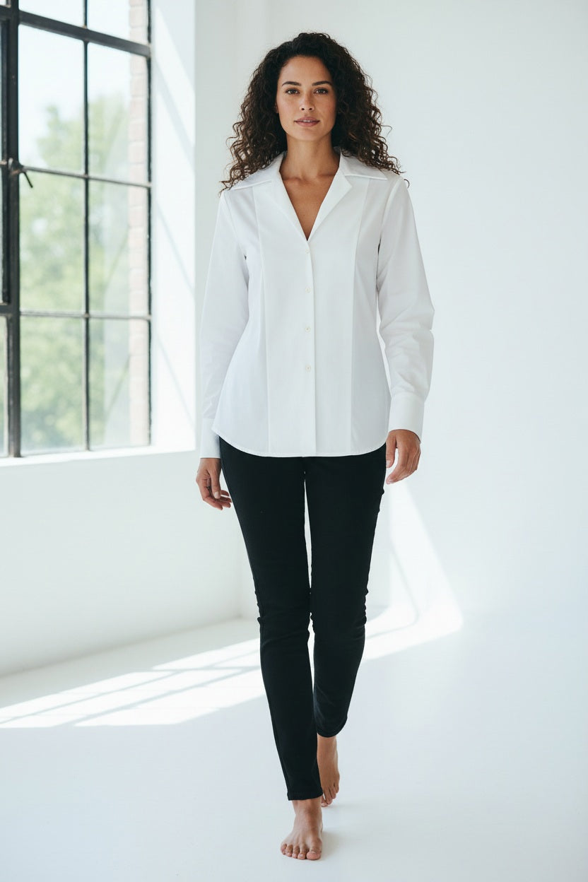A woman with blonde hair tied back is wearing the HINSON WU DONNA 3/4 SLEEVE TOP and black pants, standing against a plain light background and looking at the camera.