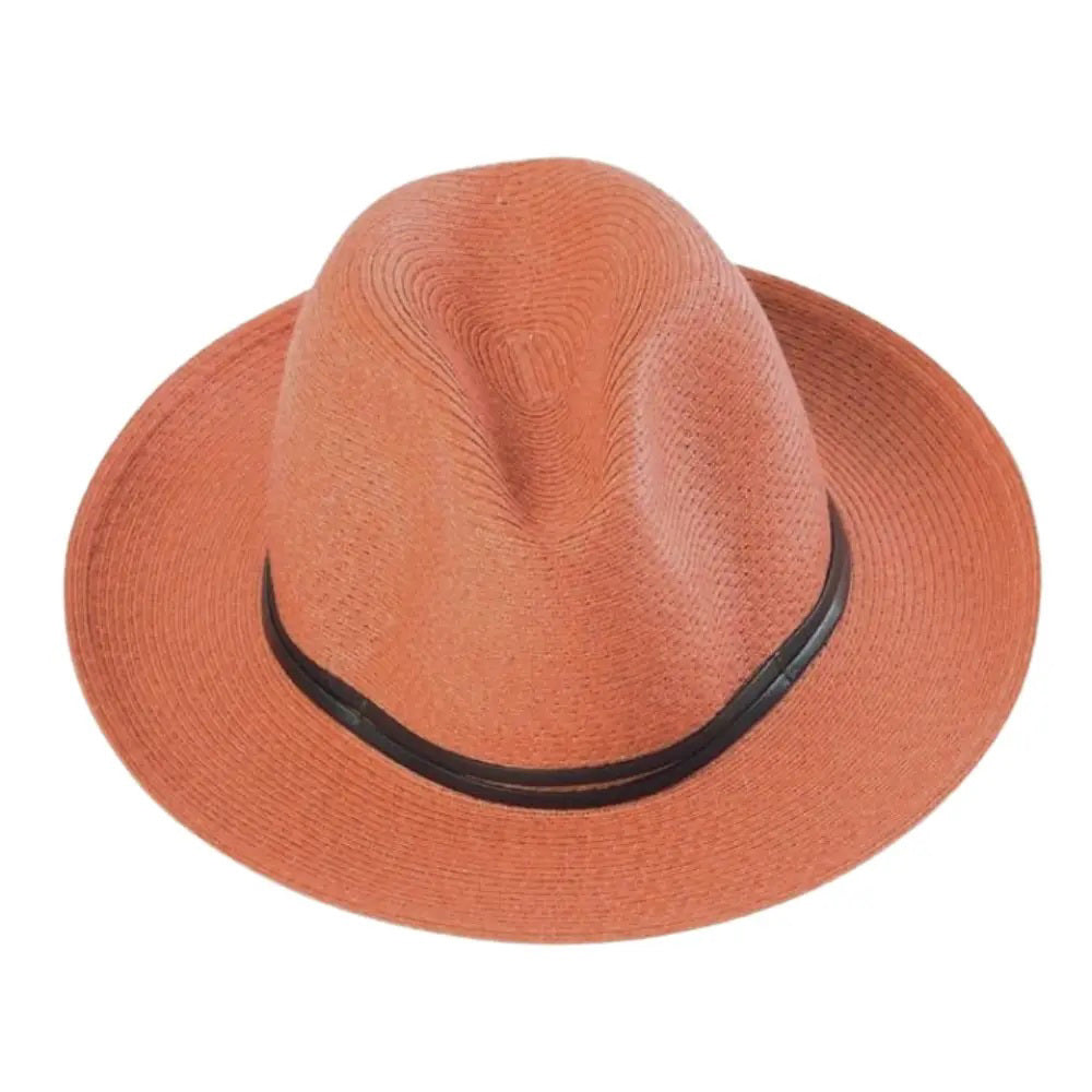 The charming LEATHER TIE PAPER HAT by TRAVAUX EN COURS is a pink, lightweight, woven pattern fedora featuring a wide brim and black band on the crown, set against a plain white background.