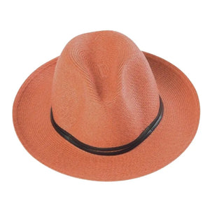 The charming LEATHER TIE PAPER HAT by TRAVAUX EN COURS is a pink, lightweight, woven pattern fedora featuring a wide brim and black band on the crown, set against a plain white background.