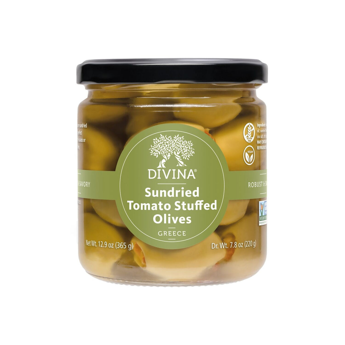 A square white dish with four sections holds DIVINA - SUNDRIED TOMATO STUFFED OLIVES, walnuts, and cashews, arranged on a wooden surface. These delicious olives by DIVINA are made in Greece and provide an authentic Mediterranean taste experience.