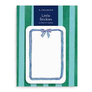 A pack of E. FRANCES PAPER "LITTLE STICKIES BLUE RIBBON" watercolor sticky notes featuring a blue ribbon border, displayed on green and dark blue striped packaging.