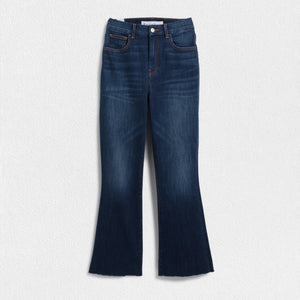 A pair of FRANK & EILEEN - Killian Crop Flare Jeans is displayed flat against a textured white background. Made from soft denim with power stretch, they feature a classic five-pocket design, belt loops, and a button and zip closure. The high-rise legs are slightly flared, offering a clean, modern appearance.