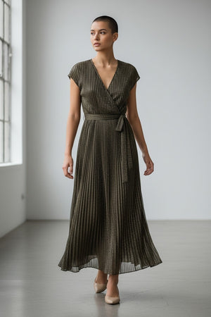 The SANDRO FERRONE - CROSSOVER V NECK DRESS is sleeveless, ankle-length, with metallic pleats, a belted waist, and a V-neckline, shown on a plain light gray background.