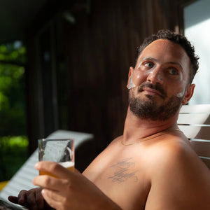 Two upright black boxes of JAXON LANE - BRO MASK HYDROGEL FACE SHEET MASK PACK OF 4 for all skin types. Award badges from Men's Health and Brides are visible in the top right corner.