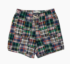 The CRIQUET Cruiser Shorts in Navy Madras feature a colorful plaid patchwork, elastic waistband with white drawstring, and are crafted from 100% cotton for comfort and style.