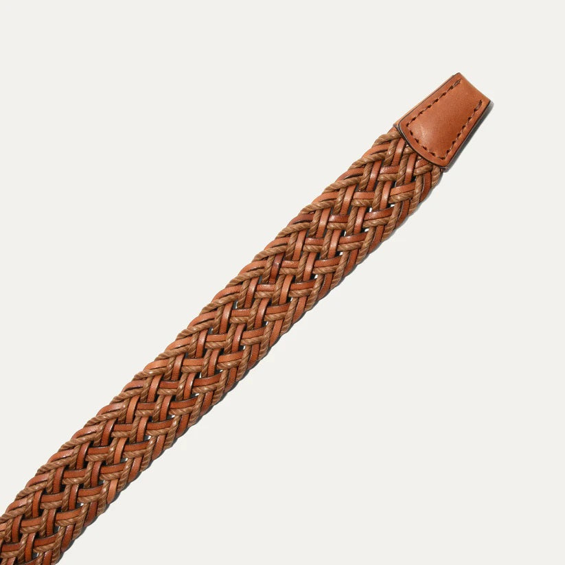 Close-up of the WILL LEATHER GOODS Leather Braided Wax Cord Belt in tan, featuring a handcrafted braided design with a solid leather tip, displayed on a plain white background.