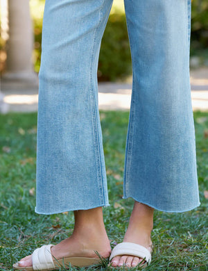 The FRANK & EILEEN GALLWAY Wide Leg Jean in Italian Dream Denim 1986 Mineral Wash features a high waist, classic five-pocket design, and hand-distressed raw hem, shown on a plain white background.