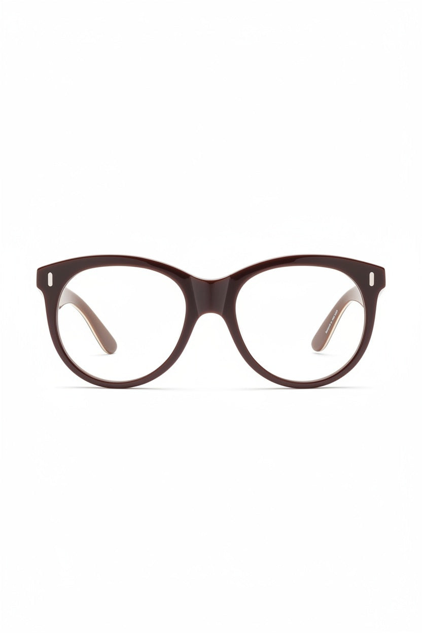 A pair of CADDIS - CHAVELA Progressive Readers in Friar Truck, featuring dark brown thick frames and round, scratch-resistant lenses, viewed from the front against a white background.
