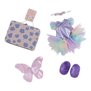 An OLLI ELLA USA DINKUM DOLL from the Pretend Pack Travel Sets, outfitted in a wide-brimmed hat, khaki overalls, and brown boots, poses with a petite suitcase. The backdrop showcases a vibrant, abstract pattern filled with diverse shapes and pastel hues, perfect for sparking endless imaginative adventures.