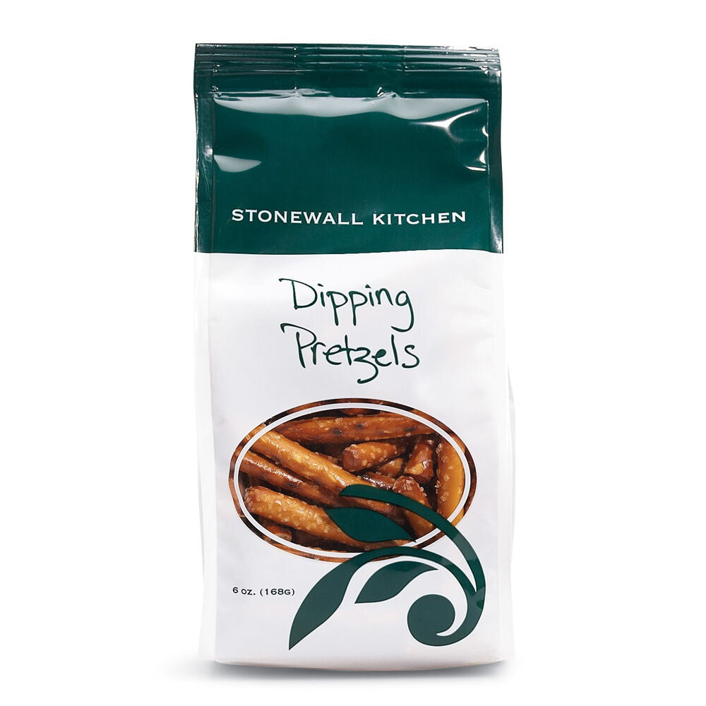 The STONEWALL KITCHEN - DIPPING PRETZELS, ideal for satisfying any snack lover's cravings, display twisted pretzels in clear packaging. The predominantly white bag with green accents includes a label at the bottom highlighting its baked firmness and 6 oz (169g) size.
