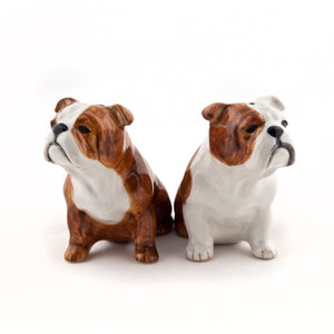 The QUAIL DESIGNS QUAIL CERAMICS English Bulldog Salt and Pepper Set features two handpainted stoneware shakers with detailed, serious expressions. Dishwasher safe for easy cleaning.